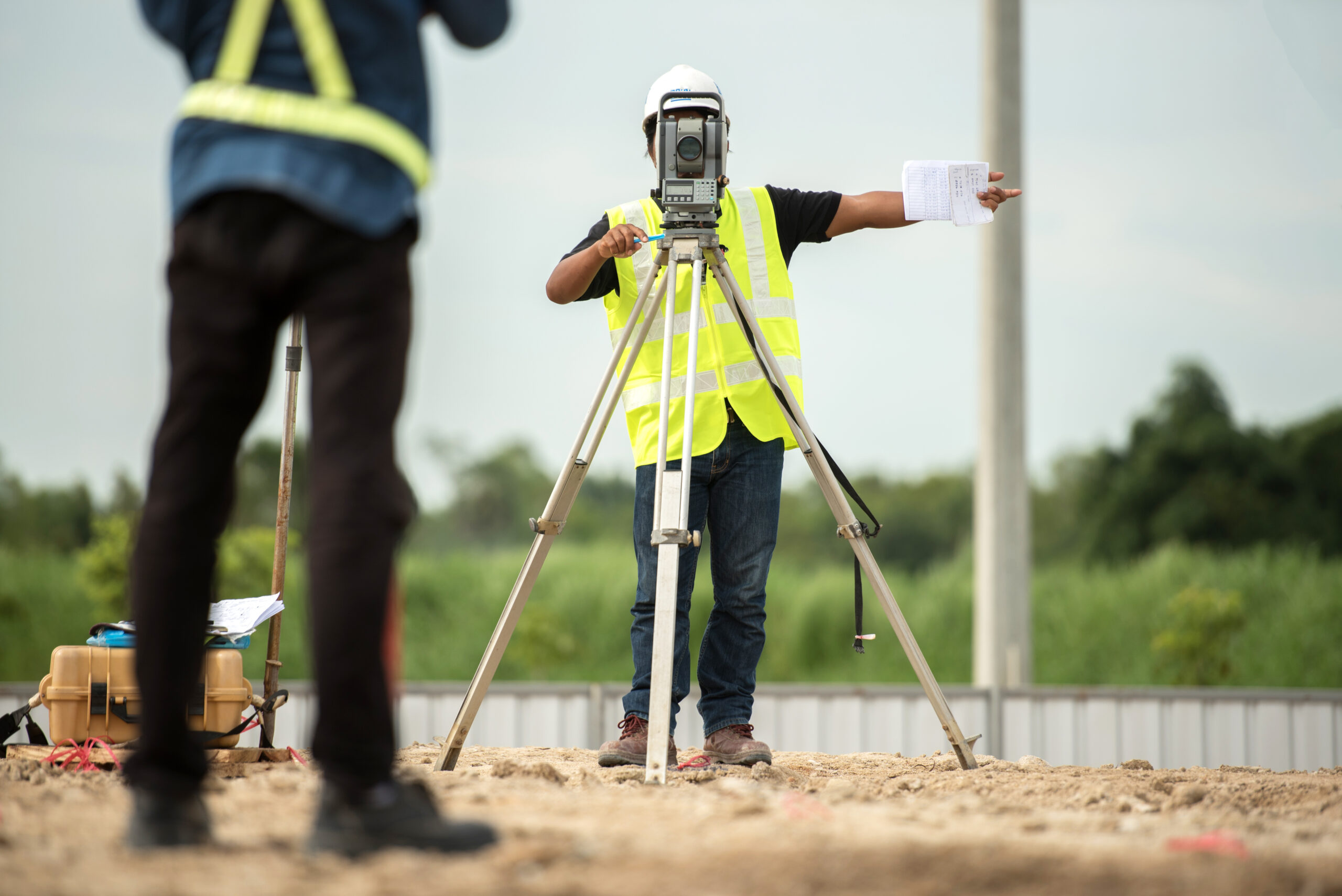 survey engineer in construction site use theodolite mark a concr