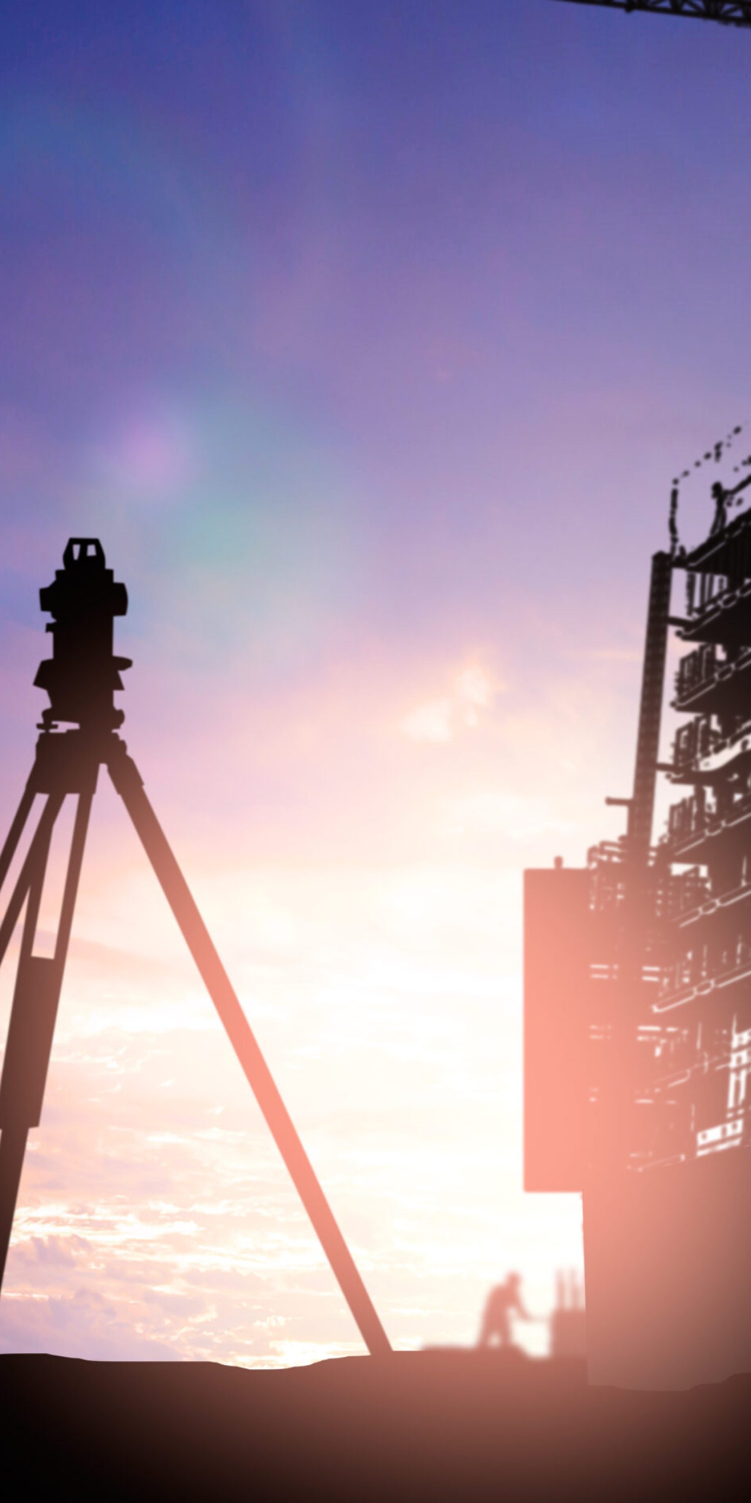 silhouette survey engineer working  in a building site over Blurred construction worker on construction site